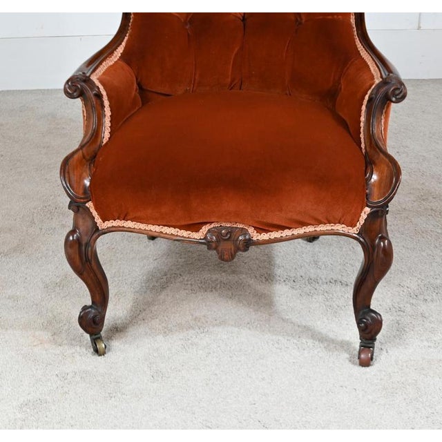 Fine Victorian mahogany parlour armchair dating to circa 1880 High shaped back with deep buttoned velvet upholstery Carved...