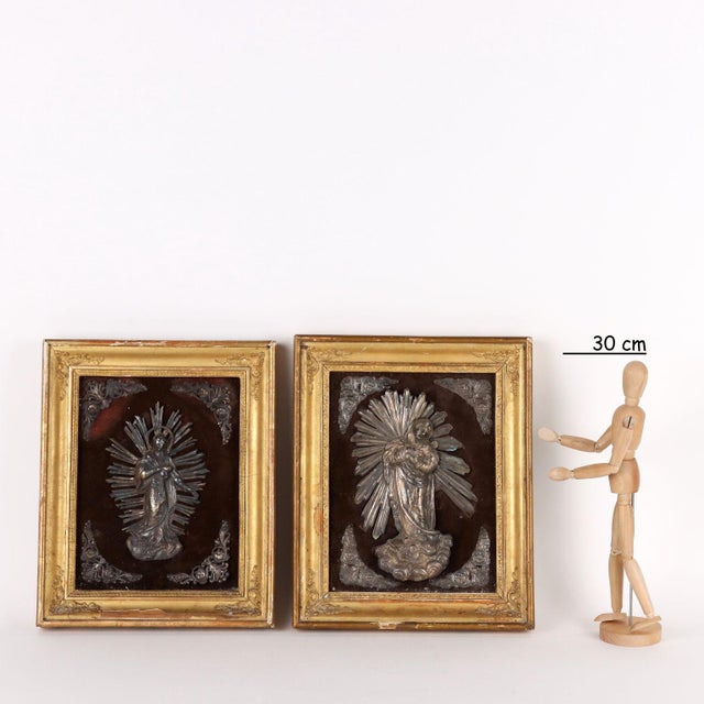 Pair of embossed silver plates depicting the Immaculate Conception of Italian manufacture; one has incussi marks but...