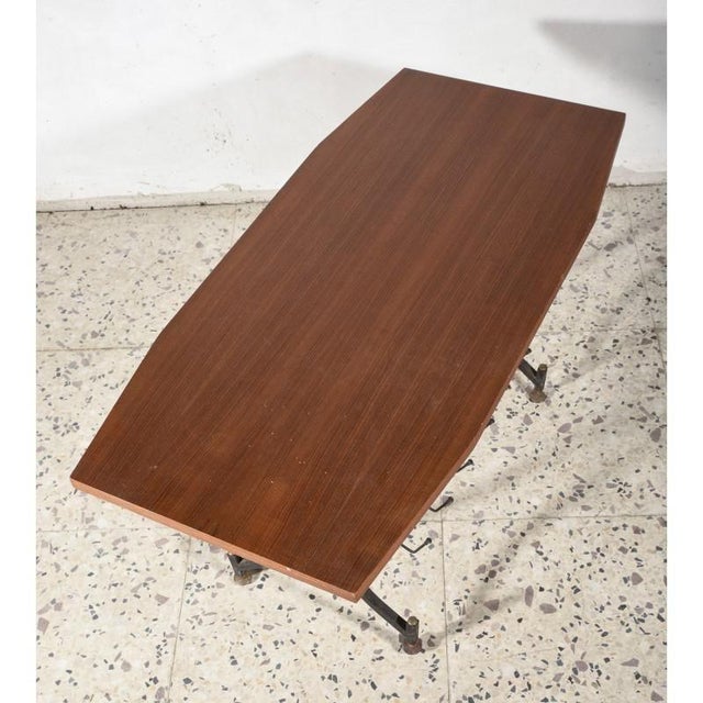 Coffee table with veneered top and base in black painted iron, never restored and original with signs of wear and time as...