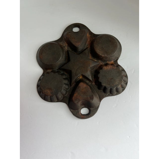 Vintage Cast Iron Pan with star, circles, hearts and scalloped edge impressions. A wonderful piece to add to your...