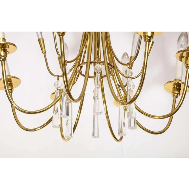 A lovely eight-arm German chandelier with crystal accents, circa 1970.