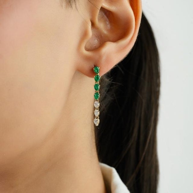 These elegant drop earrings feature 8 pear cut natural emerald totaling 0.83 carats, set in 14k yellow gold. each...