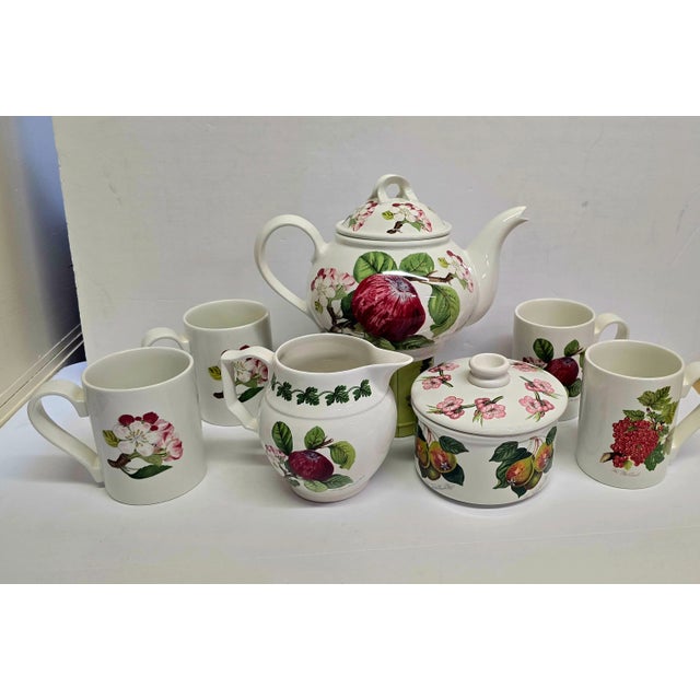 This Tea/Coffee set is so bright and cheery. Tea pot creamer, sugar bowl with lid and 4 mugs. All hand painted porcelain...