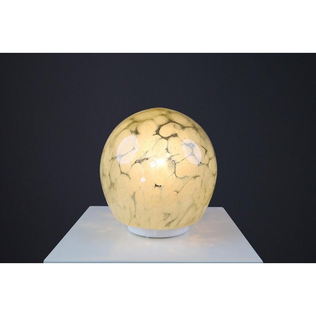 Mid-century murano glass desk/table lamp, italy 1970s this 1970s table lamp is crafted from murano glass in italy. Its...