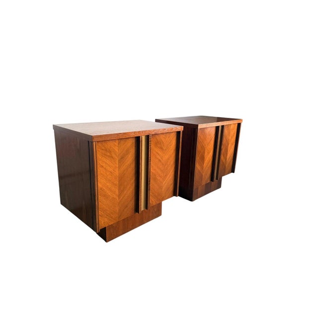 Clean pair of mid century modern walnut nightstands, made in Canada. Strong lines, great proportions, and beautiful...