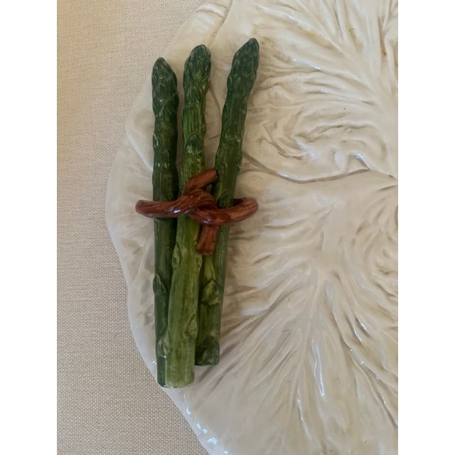 A charming Italian ceramic asparagus serving platter by Vietri, beautifully crafted in the form of a large cabbage leaf...