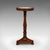This is an antique jardiniere stand. An English, walnut and marble lamp or planter table, dating to the William IV period,...