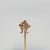 A very fine 14k yellow gold horseshoe & ribbon stickpin. With small seed pearls pave set in the horseshoe and with a small...