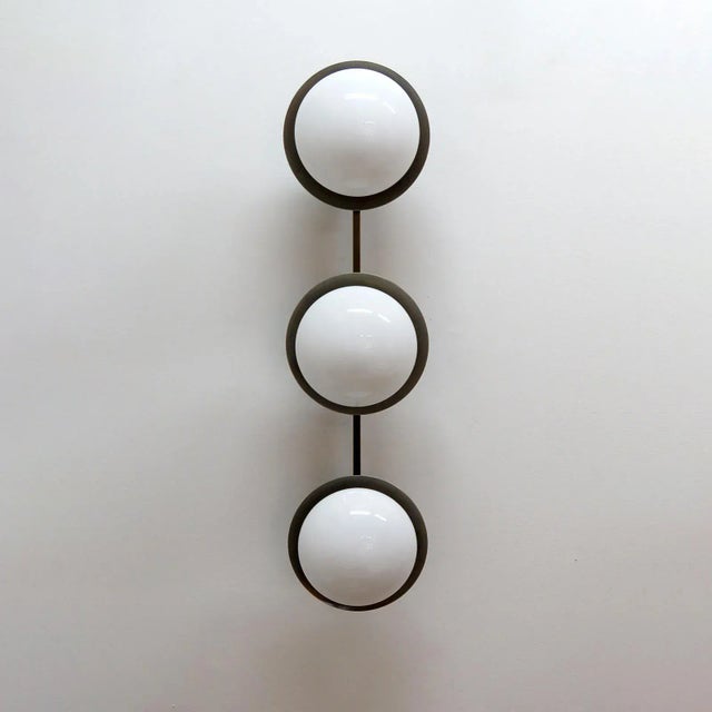 Elegant aged brass and opaline glass flushmount light “Arraid”, designed by Gallery L7, handcrafted and finished in Los...