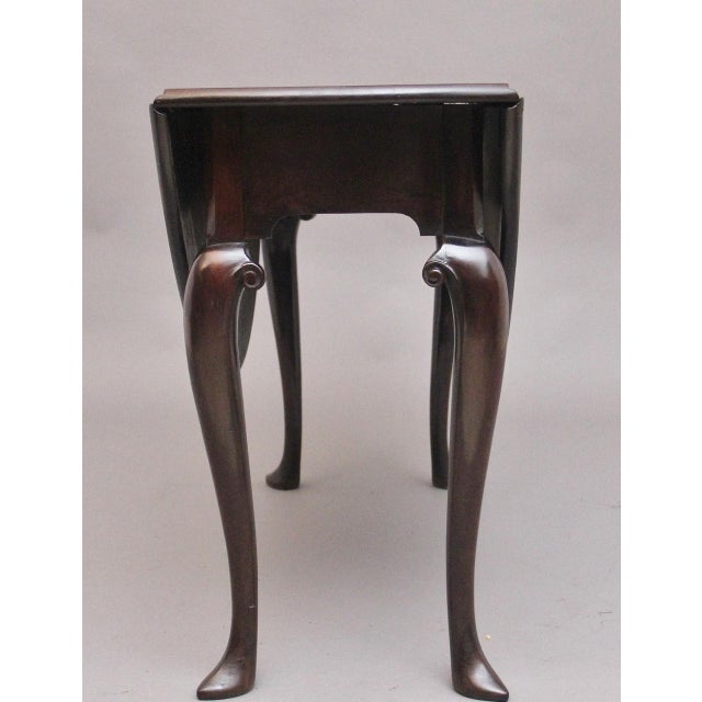 18th Century Georgian mahogany drop leaf table, having a lovely figured solid top, once the leaves are fully extended the...