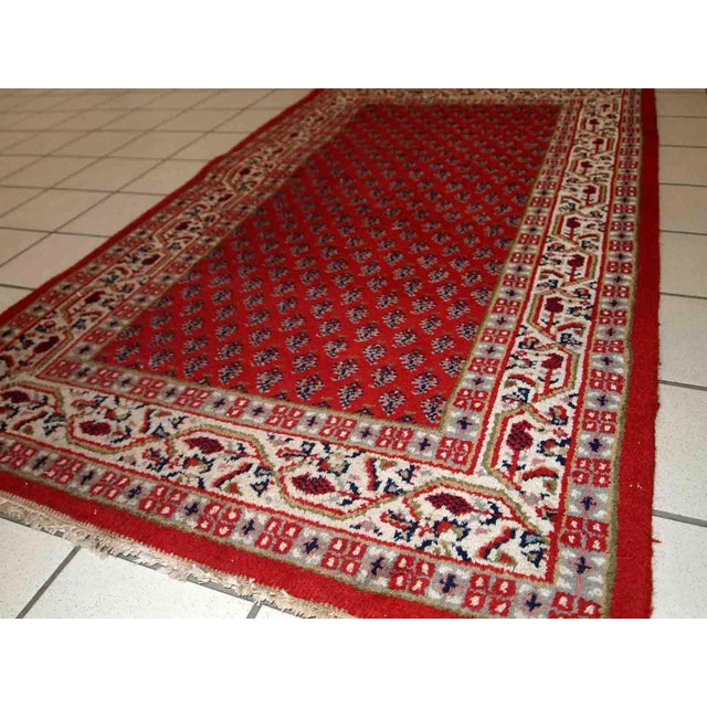 Vintage handmade Middle Eastern rug from the end of 20th century. The rug is in original good condition. It is in...