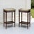 A pair of antique French Louis XVI end tables crafted of rich mahogany, each crowned with white marble set within a...