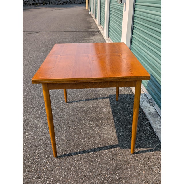 Teak veneer and beechwood constructed extendable dining table. Swedish made. Can seat up to 8 people when fully extended....