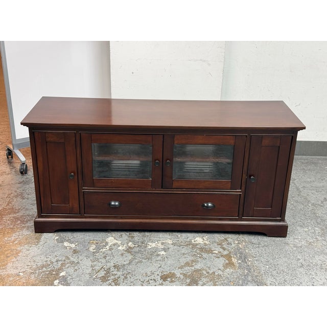 Design Plus Gallery presents a Lafayette Mahogany Media Cabinet from Crosley Furniture. This media cabinet has a...