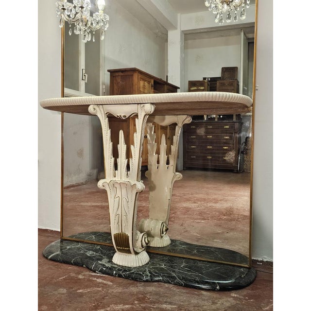 Splendid console with mirror dating back to the 1930s/40s. Green marble base. General state of conservation in good...
