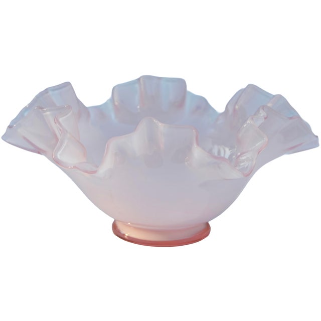 Lovely and playful heavy glass centerpiece hand-blown in a pale-peach color, featuring an elegant and sleek ruffled edges...