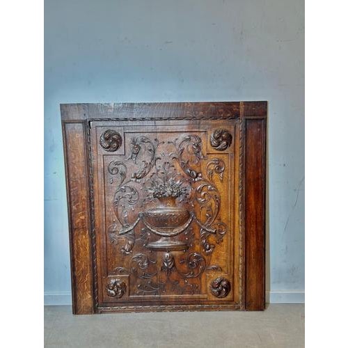Impressive 19th century carved oak panel featuring an elegant floral urn motif with rich scrollwork and deep relief...