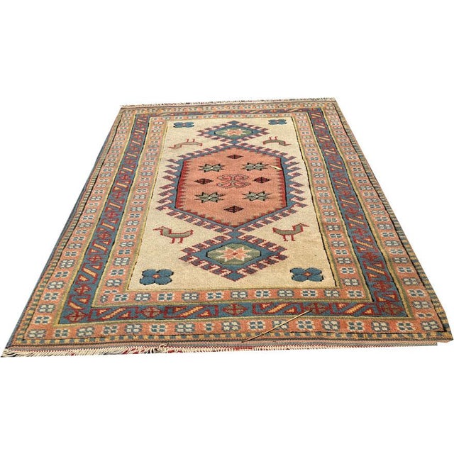 Embrace the timeless elegance of this vintage 2'-7" x 4'-7" Anatolian Turkish rug, a testament to the rich weaving...