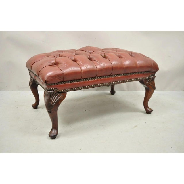 Vintage English Chesterfield Queen Anne Style Brown Leather Tufted Ottoman Footstool. Item features shell carved knees,...