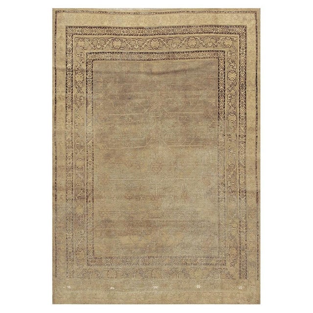 This is a spectacular and highly authentic antique Khotan wool rug, Hand-knotted along the historic Silk Road region of...