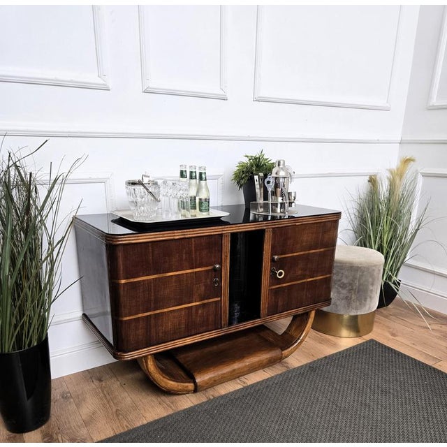 Unique and very elegant Italian Art Deco Mid-Century Modern dry bar cabinet, in beautiful veneer walnut wood, with two...
