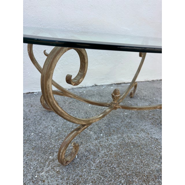 Metal Vintage Hollywood Regency Style Coffee Table Featuring a Gold-Finished Wrought Iron Base With Scrollwork and an Oval Beveled Glass Top For Sale - Image 7 of 7
