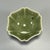 This vintage‑style petal‑lobed celadon cup is covered with glossy olive‑green glaze, presenting elegant flower‑shaped rim....