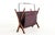 Lovely magazine rack with a teak frame and a holder in atmospheric fabric. Cool and typical Danish design with warm-...