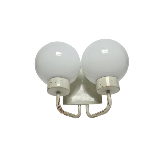 The art deco wall lamp is from the 70s. Condition is good. This piece has an attribution mark, I am sure that it is...