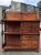 A large and impressive 18th century Early American cupboard characterized by a molded cornice over two plate racks and a...