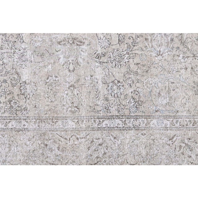 This vintage Persian Tabriz rug, measuring 11'1" x 14'1", is handwoven in Northern Iran’s Tabriz region and has been...