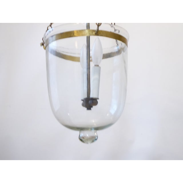 This bell light has updated wiring and uses two up to 60 Watt candelabra base bulbs.