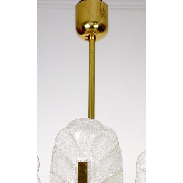 Scandinavian Brass and Ice Glass 8-Light Chandelier by Carl Fagerlund for JSB, 1960s, in Very Good conditions. Designed...