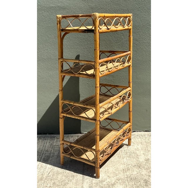 Highlighting organic mid-century craftsmanship, this open-frame four-tier étagère is constructed from sturdy bent bamboo...