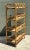 Highlighting organic mid-century craftsmanship, this open-frame four-tier étagère is constructed from sturdy bent bamboo...