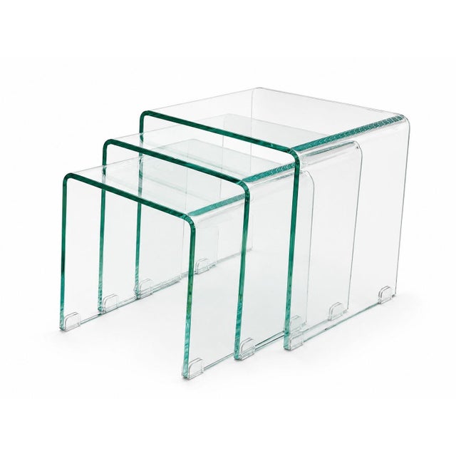 A refined set of three Italian waterfall glass nesting tables, dating to the 20th century. Crafted entirely from clear...