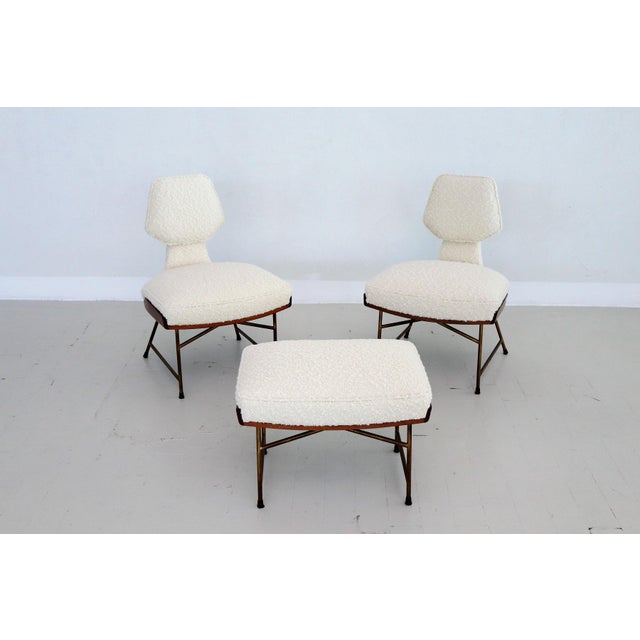 Very rare set of three pieces composed of two low slipper chairs and one ottoman or footstool. Designed by Renzo Zavanella...