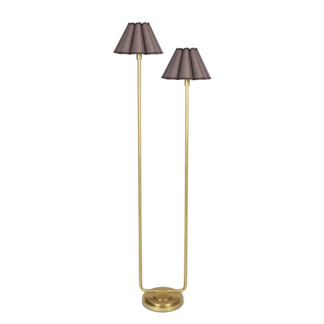The Polly Floor Lamp exudes timeless elegance with its two scalloped shades, casting a soft, comforting glow that enhances...