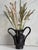 Black ceramic vase in a rustic antique-inspired form, blending wabi-sabi and minimalist aesthetics. Waterproof Approximate...