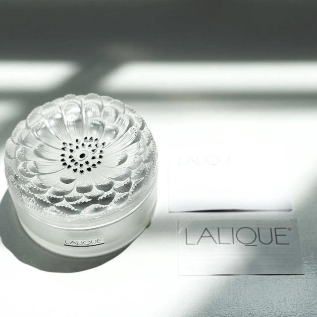 Vintage Lalique Crystal Powder Box – Dahlia Model: A refined frosted crystal design featuring sleek black enamel-tipped...