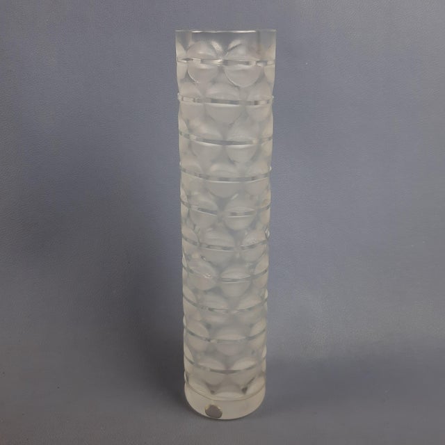Elegant crystal vase, with a particular satin-finished transparent column shape, external decorations with geometric...