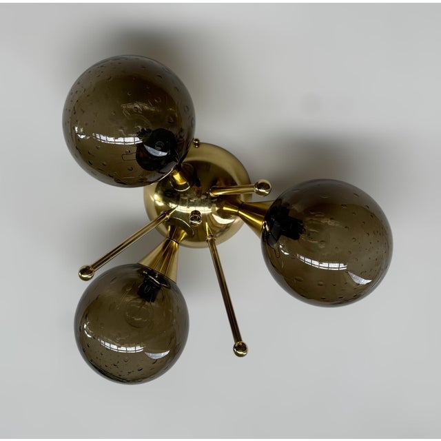 Italian flush mount with three smoky Murano glass globes carefully hand blown with bubbles inside the glass using...