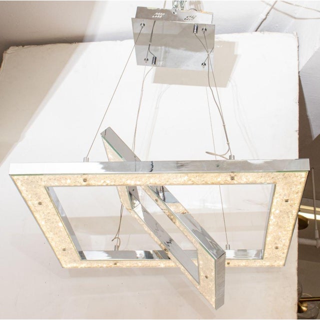 Modern Minimalist "Crushed Ice" Pendant Lamp, the chromed metal frame filled with glass crystal elements held by acrylic...