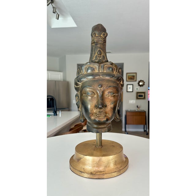 Vintage gilt bronze bust of the Buddhist deity Kannon Bosatsu. Constructed of hollow-cast bronze with traces of gold...