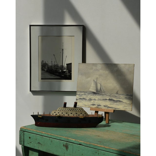 Vintage Steely Seascape Painting on Board, Signed by the Artist, Circa Mid-20th Century. Cloudy skies and a choppy sea are...