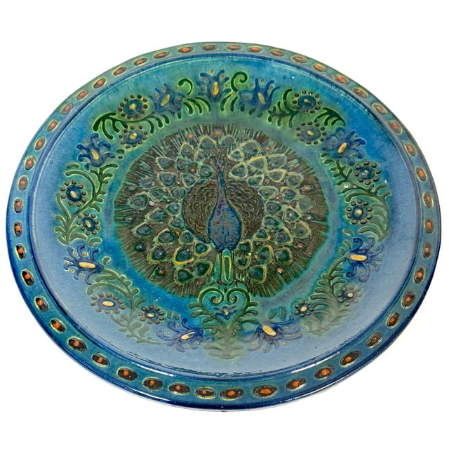 Welsh Arts & Crafts Peacock Charger by John Lang, Aberamffra, circa 1910–1925 12.5" diameter x 1.5" high A richly...