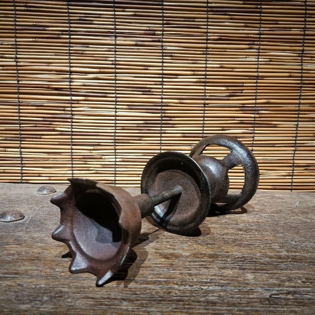 This is a unique and collectable Asian Iron Casting Candle Holder.