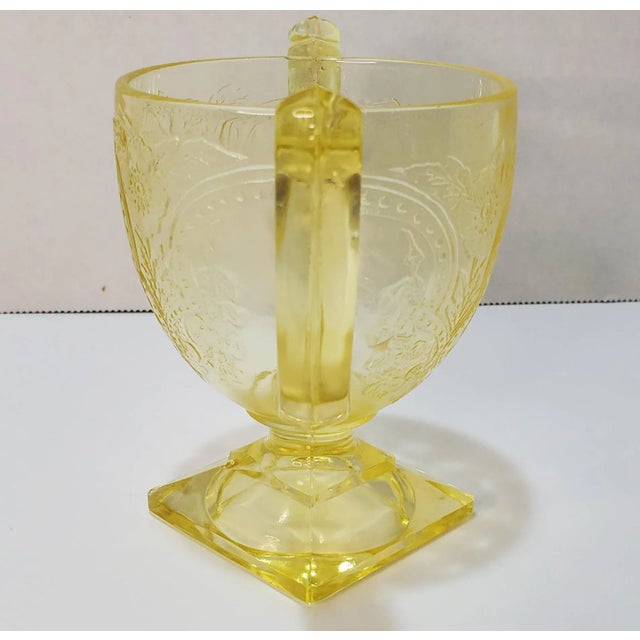 Pattern: Horseshoe Color: Yellow Manufacturer: Indiana Glass Company Date Produced: 1930-1933 Shape: Footed Open Sugar