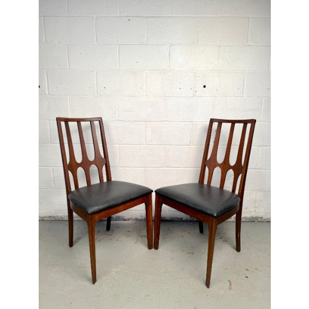 Make a bold statement with this rare set of six Broyhill “Brasilia” dining chairs, a celebrated icon of American mid-...
