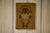 Pair of 1970s paintings on burlap, featuring figurative, ethnic/folk-inspired motifs. Stylized figures with large eyes and...